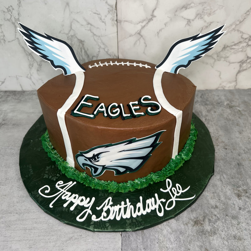 Football Shaped Cake with Eagles Logo